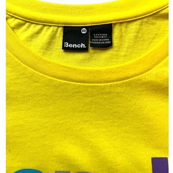 Bench Women's Baby T Shirt Capped Sleeves Soft Bright Yellow Graphic Tee Size XS - Picture 2 of 7